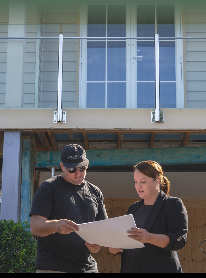 Reviewing renovation plans Gold Coast builder reviewing renovation plans before preparing a fixed price quote