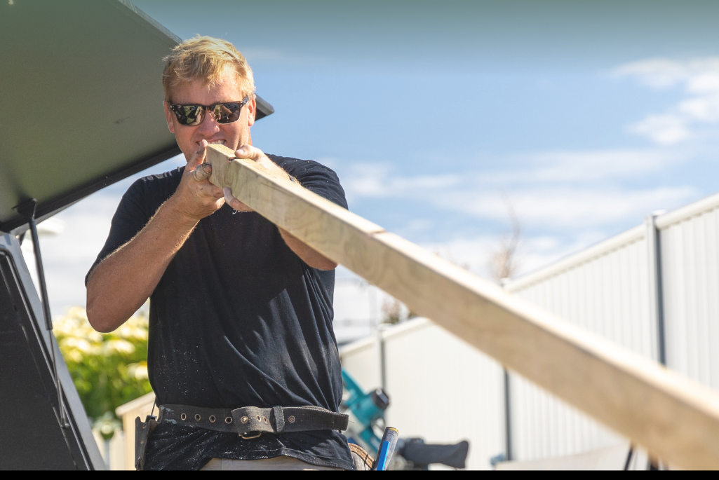 Reviewing renovation plans Steve McIntyre from Dellwood Constructions, winner of the Master Builders Gold Coast Rising Star Award, working on a renovation project