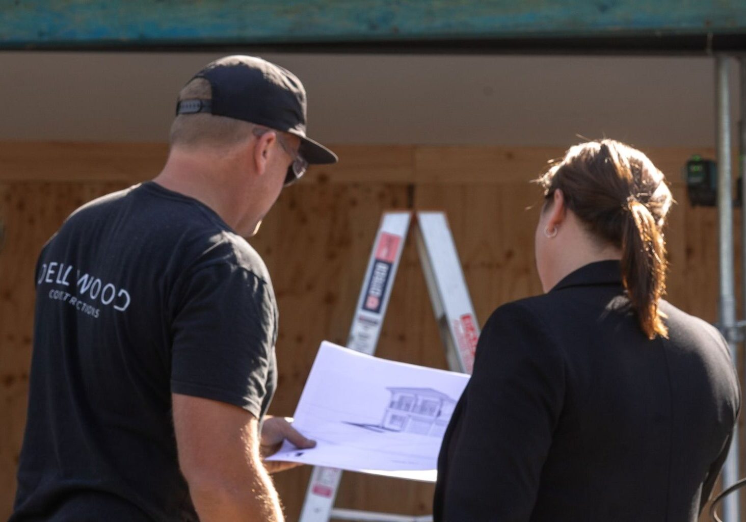 Builder looking over plans on site before starting a renovation on the Southern Gold Coast